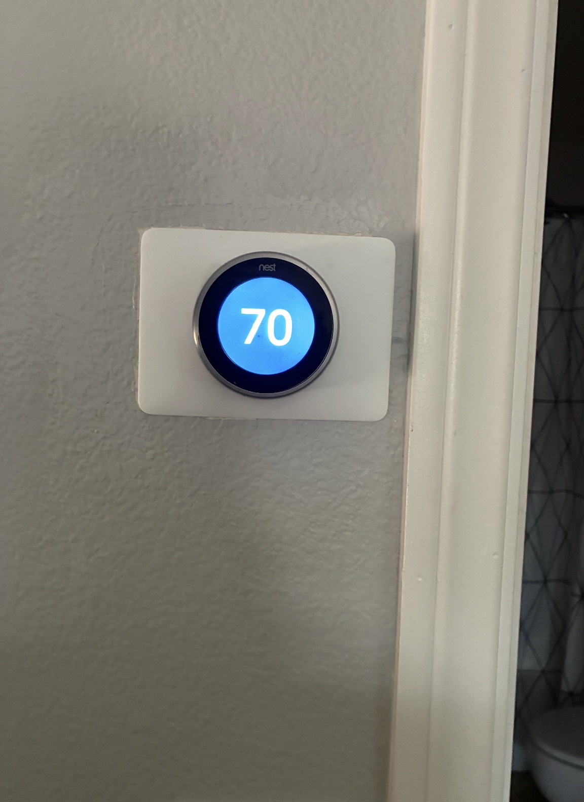 Google Nest smart thermostat installed in a Las Vegas home showing 70°F setpoint